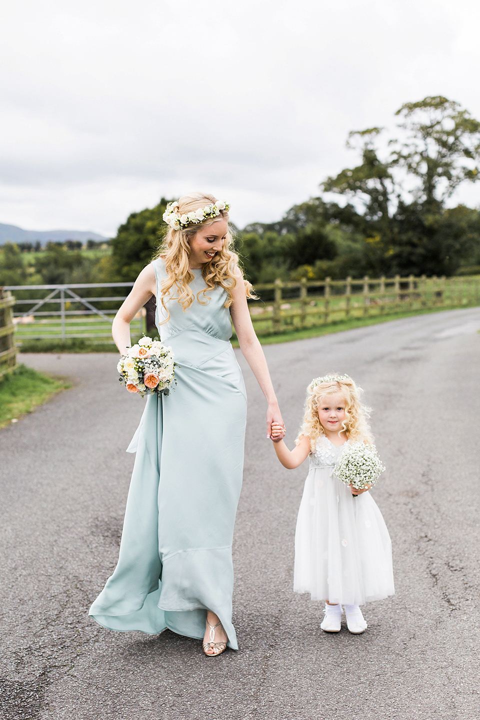 Nicole wearsa Stephanie Allin gown for her seafoam green inspired Summer wedding at Peterstone Court. Film photography by Victoria Phipps.