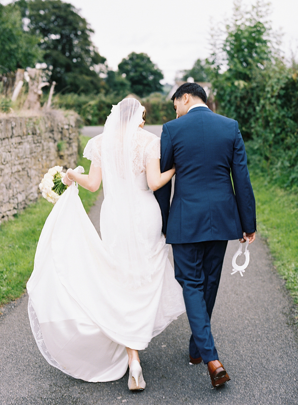 Nicole wearsa Stephanie Allin gown for her seafoam green inspired Summer wedding at Peterstone Court. Film photography by Victoria Phipps.