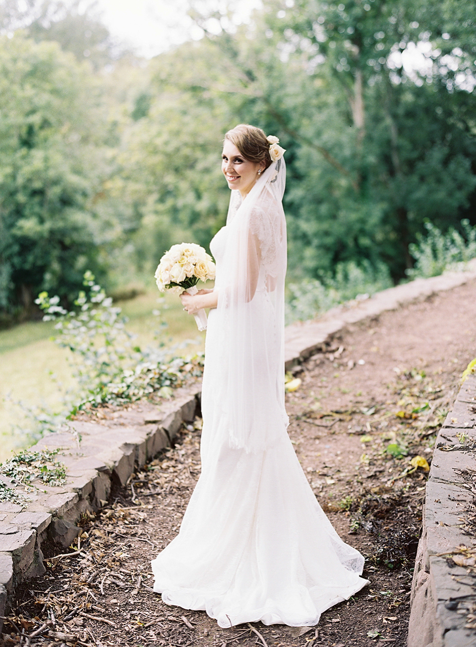 Nicole wearsa Stephanie Allin gown for her seafoam green inspired Summer wedding at Peterstone Court. Film photography by Victoria Phipps.