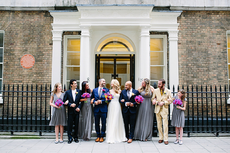 Kim wore a Leanne Marshall gown for her bright and colourful, art and science inspired wedding at RSA House in London. Photography by Hayley Savage.