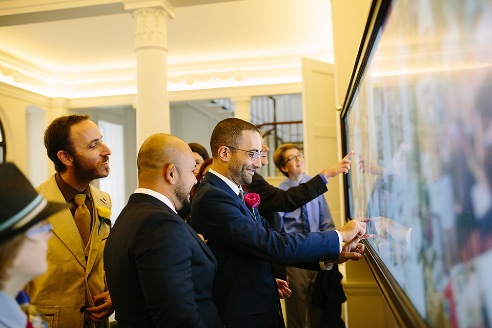 Kim wore a Leanne Marshall gown for her bright and colourful, art and science inspired wedding at RSA House in London. Photography by Hayley Savage.