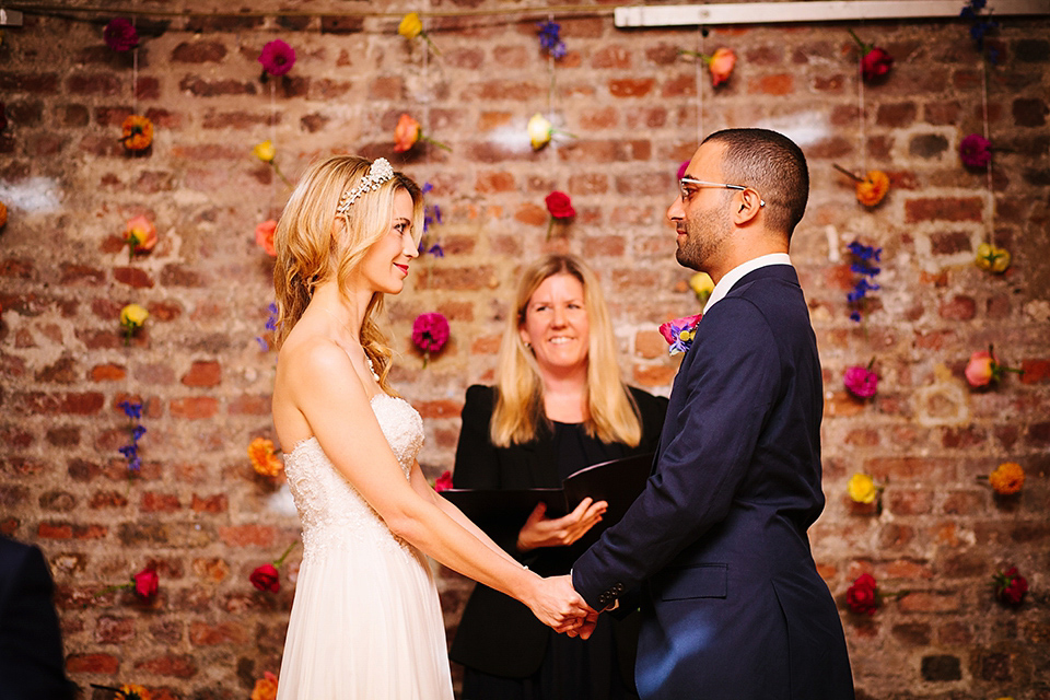 Kim wore a Leanne Marshall gown for her bright and colourful, art and science inspired wedding at RSA House in London. Photography by Hayley Savage.