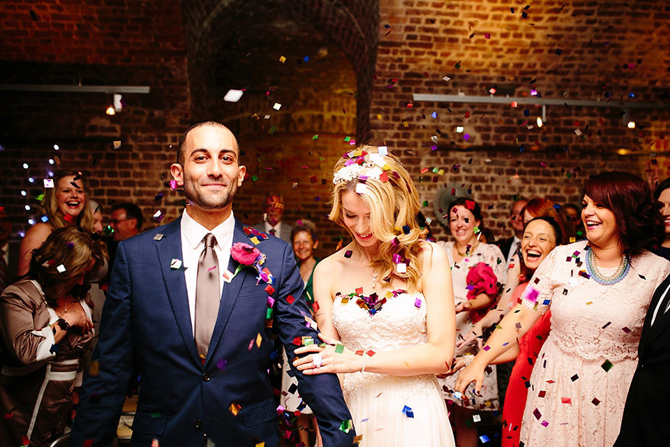 Kim wore a Leanne Marshall gown for her bright and colourful, art and science inspired wedding at RSA House in London. Photography by Hayley Savage.