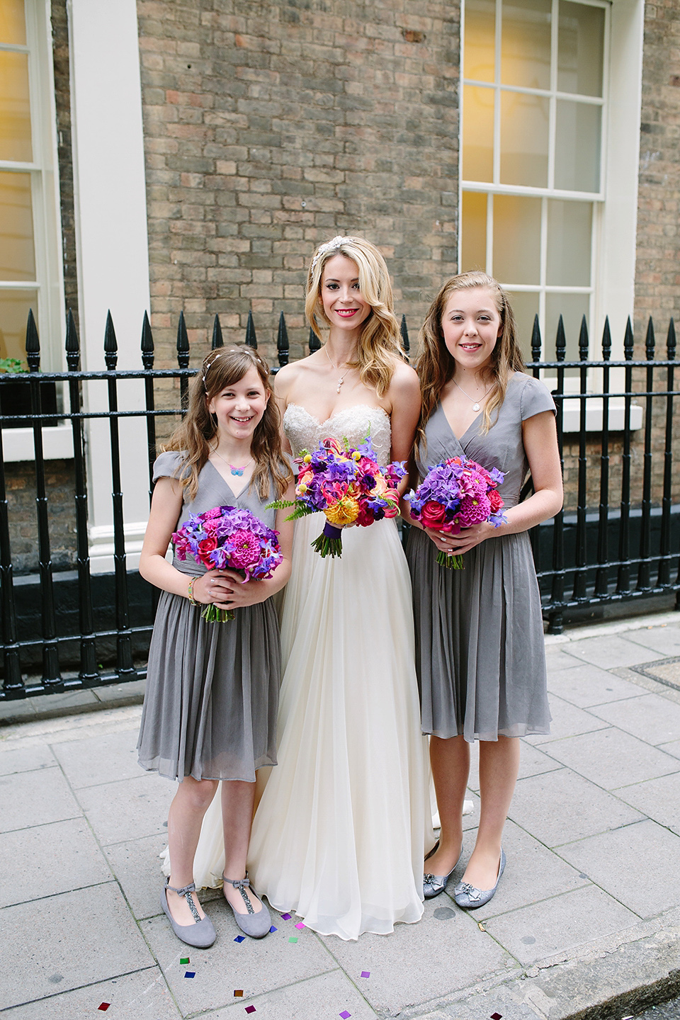 Kim wore a Leanne Marshall gown for her bright and colourful, art and science inspired wedding at RSA House in London. Photography by Hayley Savage.