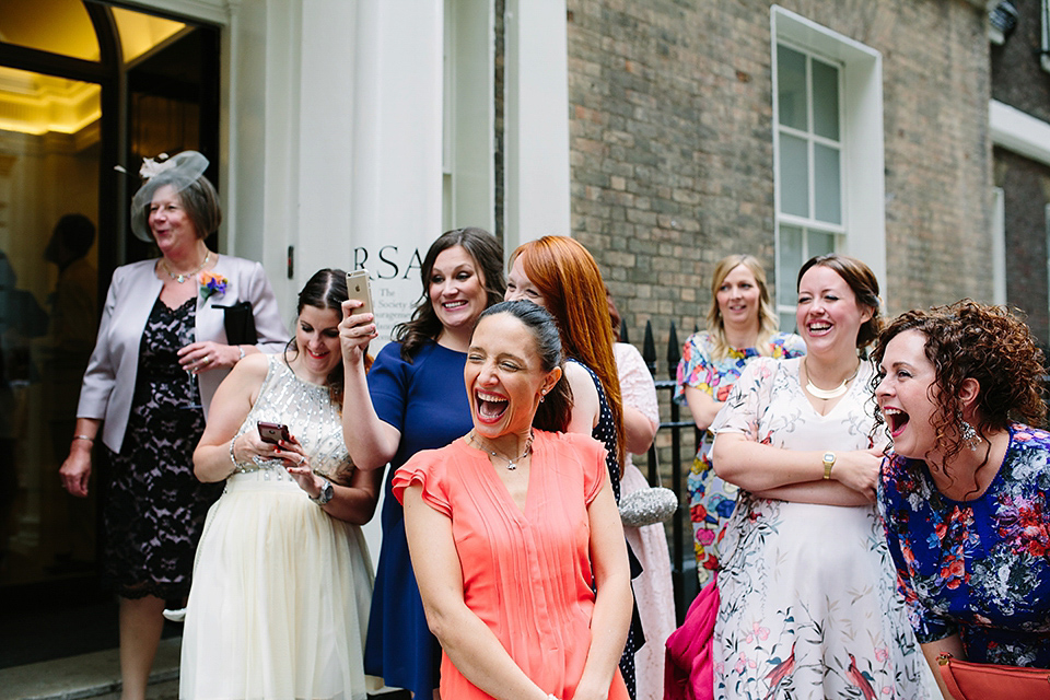 Kim wore a Leanne Marshall gown for her bright and colourful, art and science inspired wedding at RSA House in London. Photography by Hayley Savage.