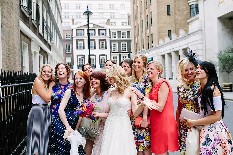 Kim wore a Leanne Marshall gown for her bright and colourful, art and science inspired wedding at RSA House in London. Photography by Hayley Savage.