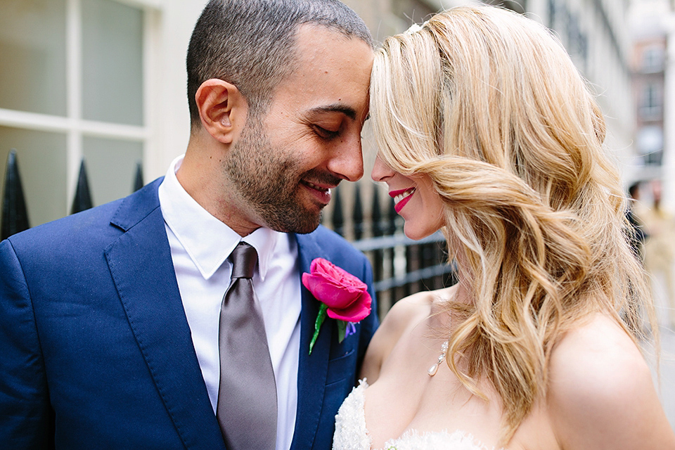 Kim wore a Leanne Marshall gown for her bright and colourful, art and science inspired wedding at RSA House in London. Photography by Hayley Savage.