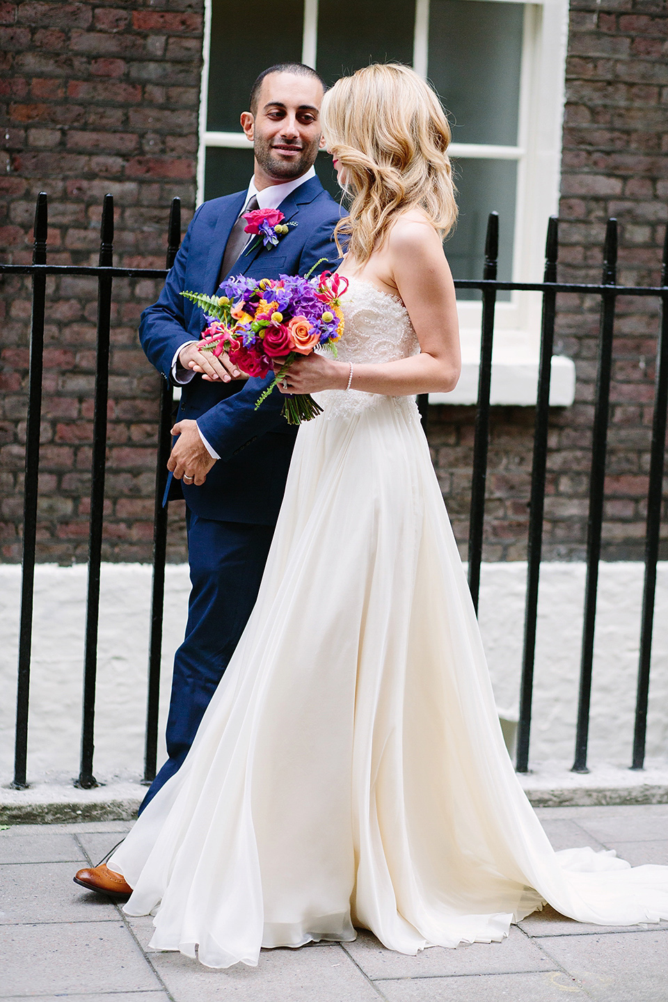 Kim wore a Leanne Marshall gown for her bright and colourful, art and science inspired wedding at RSA House in London. Photography by Hayley Savage.