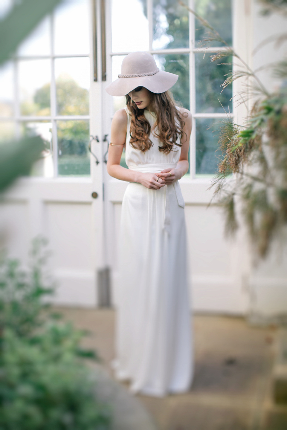 Beautiful 70's inspiration for the stylish modern bride. Styling by Cicily bridal using Halfpenny London and Charlie Brear gowns. Accessories by Debbie Carlisle. Photography by Jess Petrie.