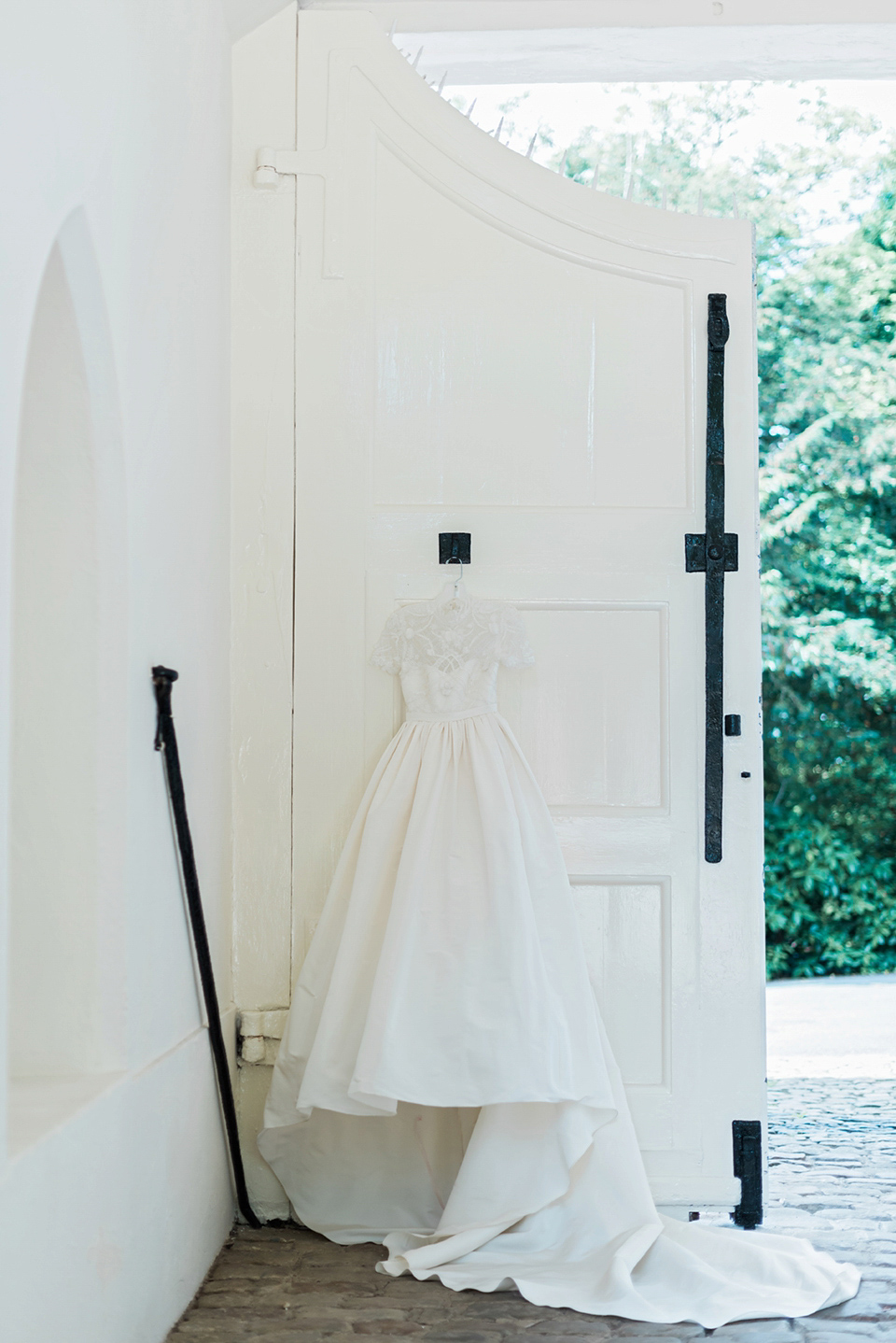 A Marchesa dress and Prada shoes for an elegant English country wedding at Farnham Castle. Photography by Dominique Bader.