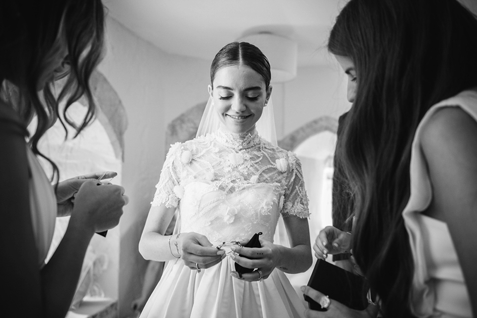 A Marchesa dress and Prada shoes for an elegant English country wedding at Farnham Castle. Photography by Dominique Bader.