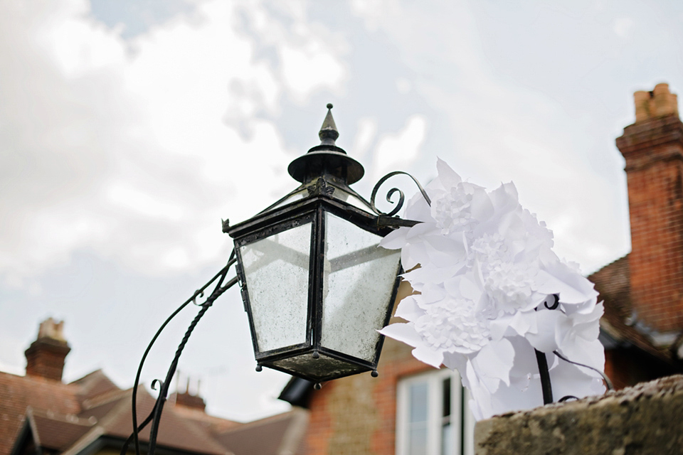 A Marchesa dress and Prada shoes for an elegant English country wedding at Farnham Castle. Photography by Dominique Bader.