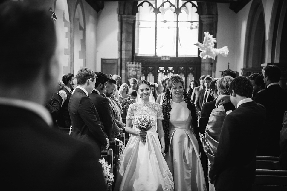 A Marchesa dress and Prada shoes for an elegant English country wedding at Farnham Castle. Photography by Dominique Bader.