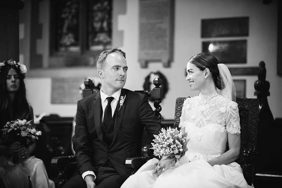 A Marchesa dress and Prada shoes for an elegant English country wedding at Farnham Castle. Photography by Dominique Bader.