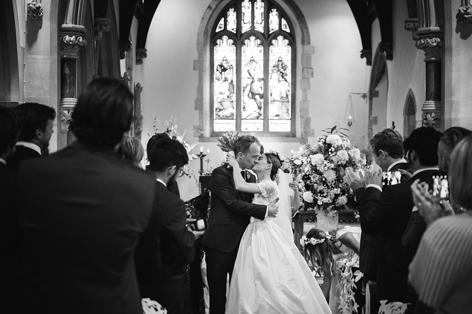 A Marchesa dress and Prada shoes for an elegant English country wedding at Farnham Castle. Photography by Dominique Bader.