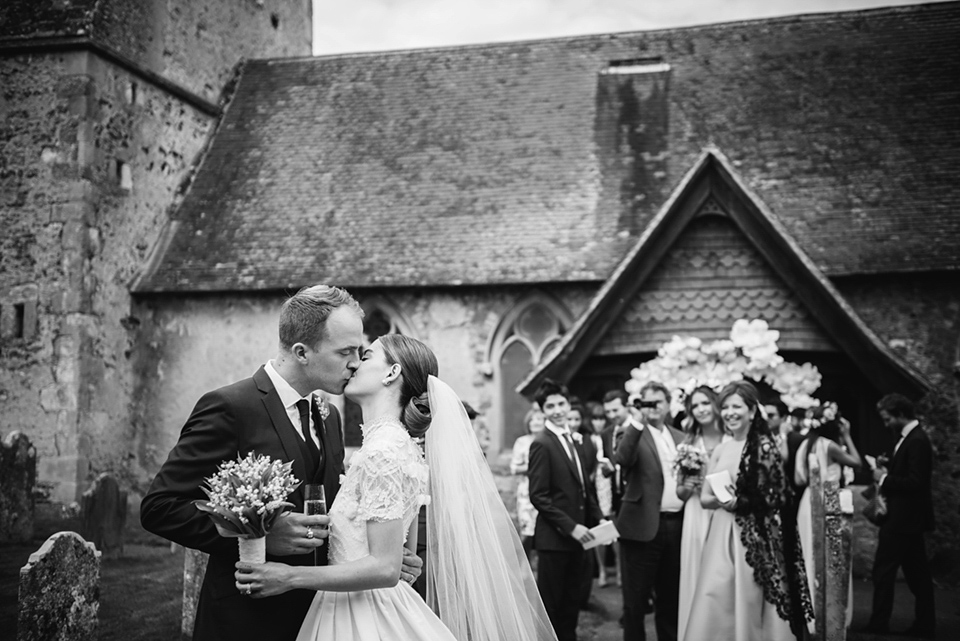 A Marchesa dress and Prada shoes for an elegant English country wedding at Farnham Castle. Photography by Dominique Bader.