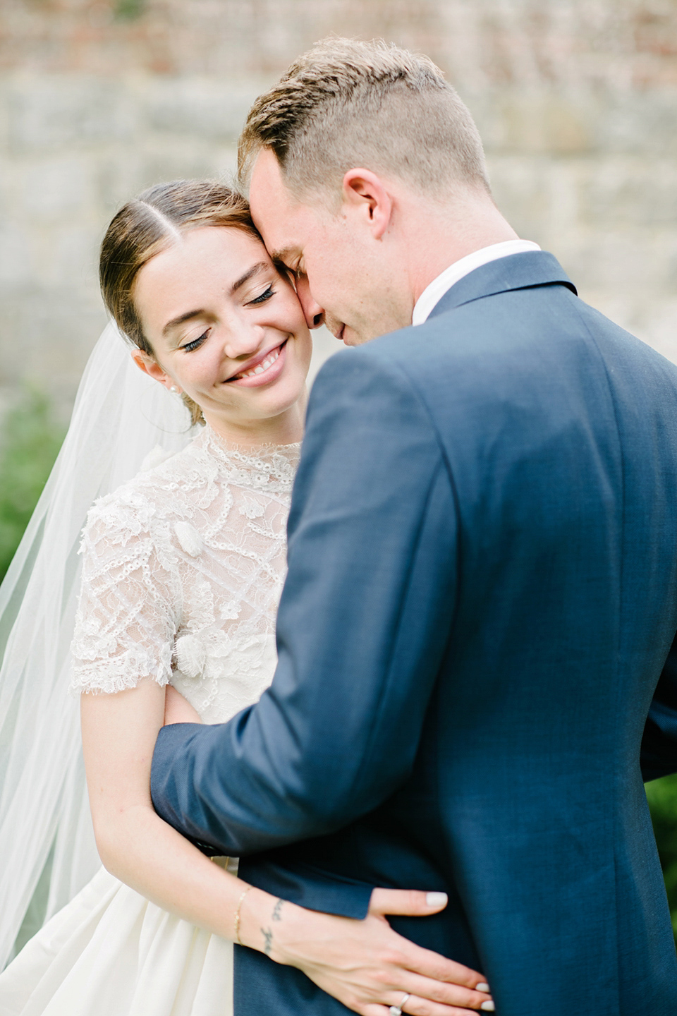 A Marchesa dress and Prada shoes for an elegant English country wedding at Farnham Castle. Photography by Dominique Bader.