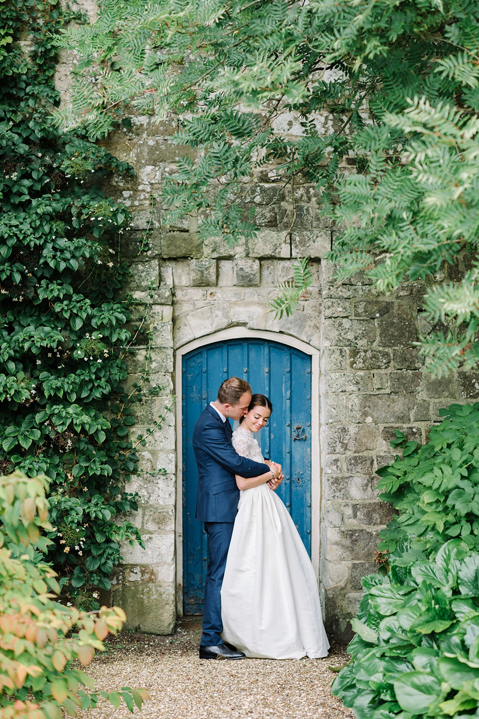 A Marchesa dress and Prada shoes for an elegant English country wedding at Farnham Castle. Photography by Dominique Bader.