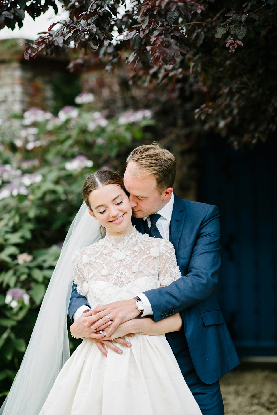 A Marchesa dress and Prada shoes for an elegant English country wedding at Farnham Castle. Photography by Dominique Bader.