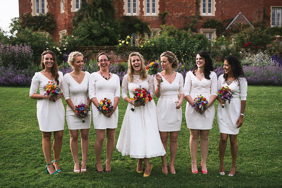 A tea length gown for a colourful, street food, summer party wedding. Photography by Kristian Leven.