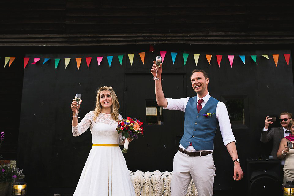 A tea length gown for a colourful, street food, summer party wedding. Photography by Kristian Leven.