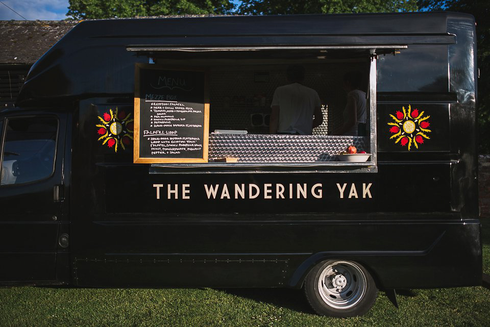 A tea length gown for a colourful, street food, summer party wedding. Photography by Kristian Leven.