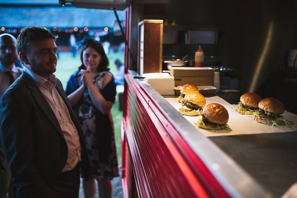 A tea length gown for a colourful, street food, summer party wedding. Photography by Kristian Leven.