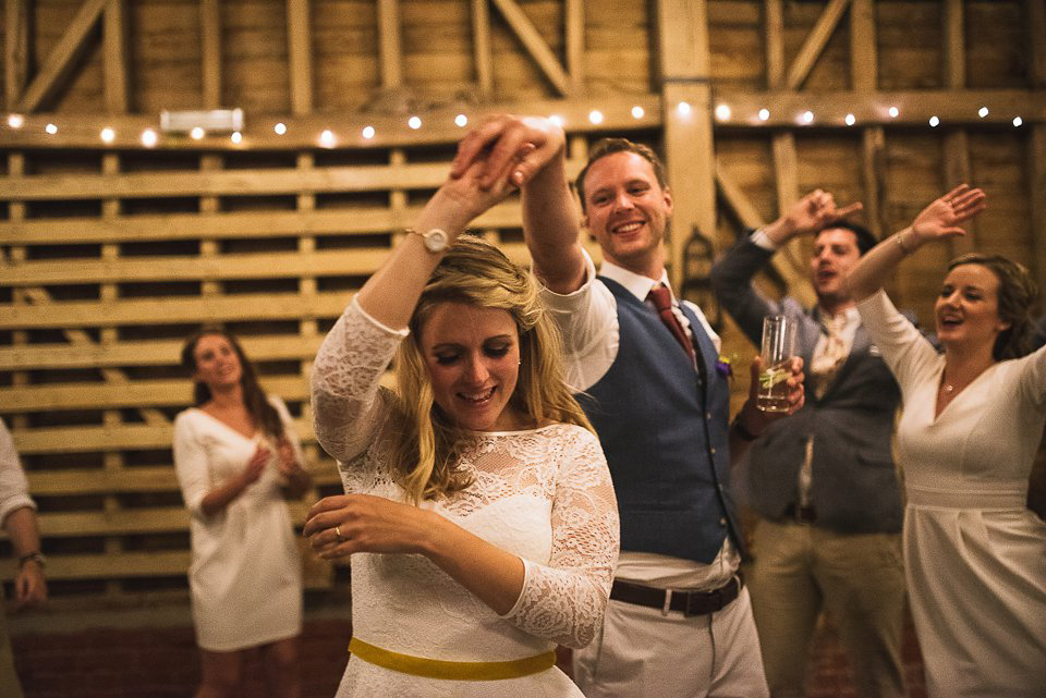 A tea length gown for a colourful, street food, summer party wedding. Photography by Kristian Leven.