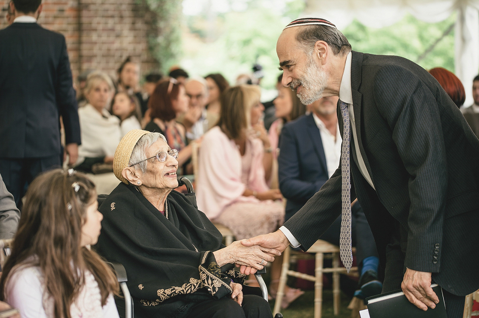 A modern Jewish wedding - the bride wears a gown by Wilden Bride. Photography by Kat Hill.