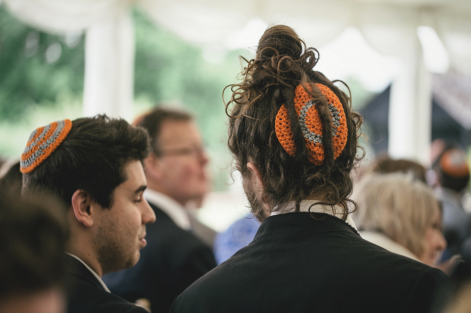 A modern Jewish wedding - the bride wears a gown by Wilden Bride. Photography by Kat Hill.