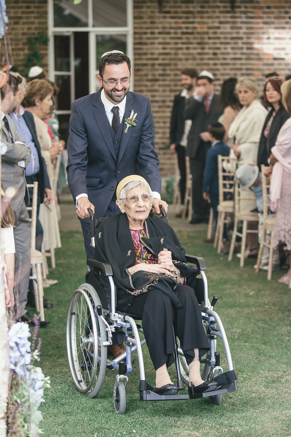 A modern Jewish wedding - the bride wears a gown by Wilden Bride. Photography by Kat Hill.