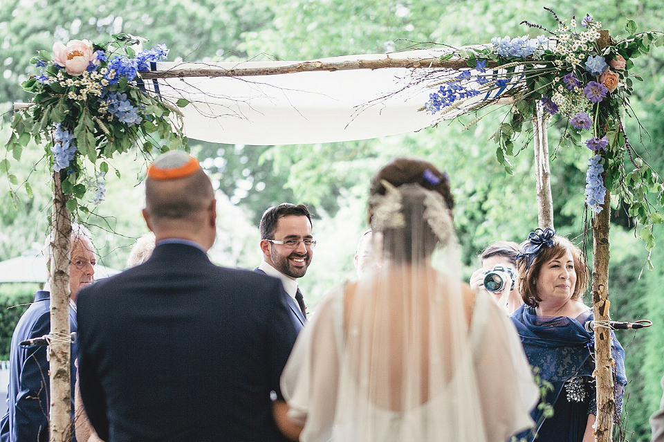 A modern Jewish wedding - the bride wears a gown by Wilden Bride. Photography by Kat Hill.