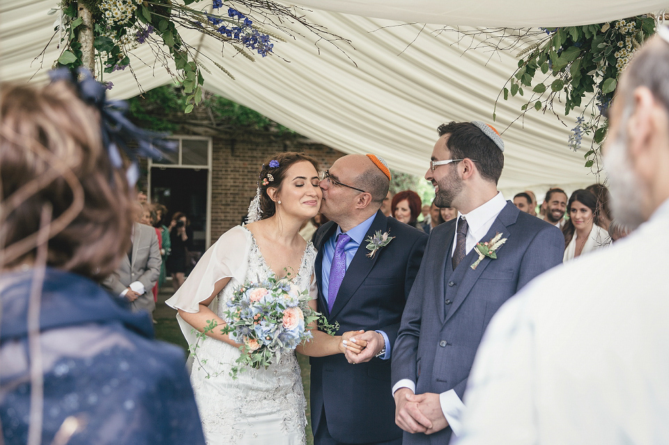 A modern Jewish wedding - the bride wears a gown by Wilden Bride. Photography by Kat Hill.