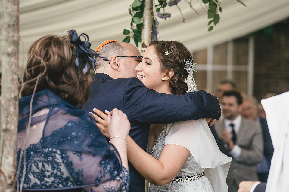 A modern Jewish wedding - the bride wears a gown by Wilden Bride. Photography by Kat Hill.