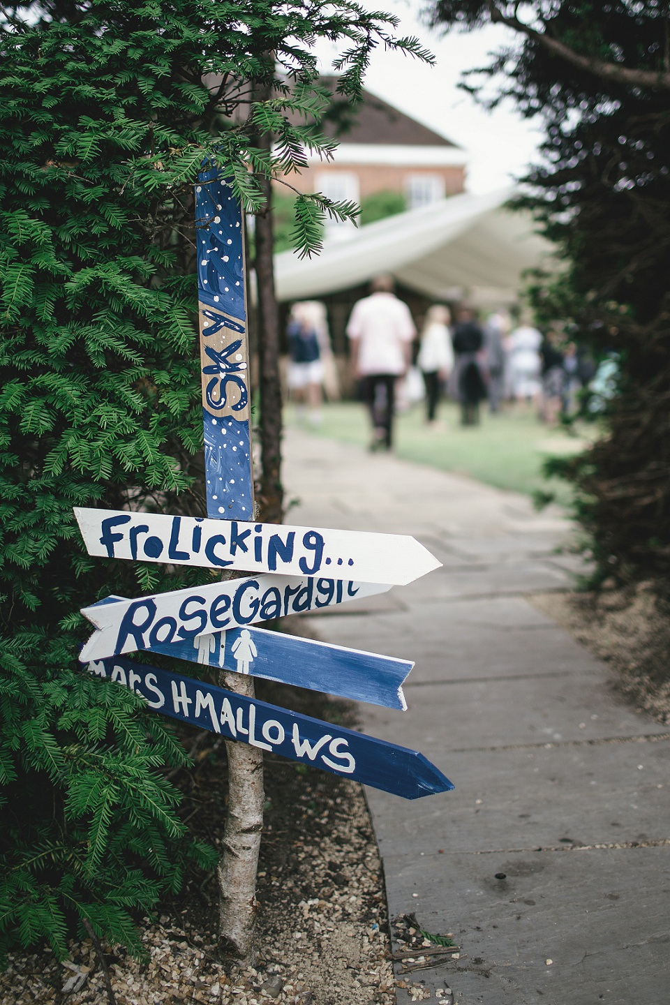 A modern Jewish wedding - the bride wears a gown by Wilden Bride. Photography by Kat Hill.