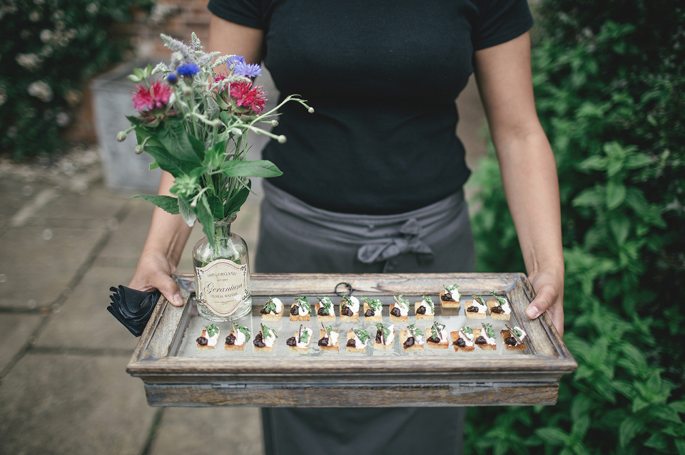 A modern Jewish wedding - the bride wears a gown by Wilden Bride. Photography by Kat Hill.