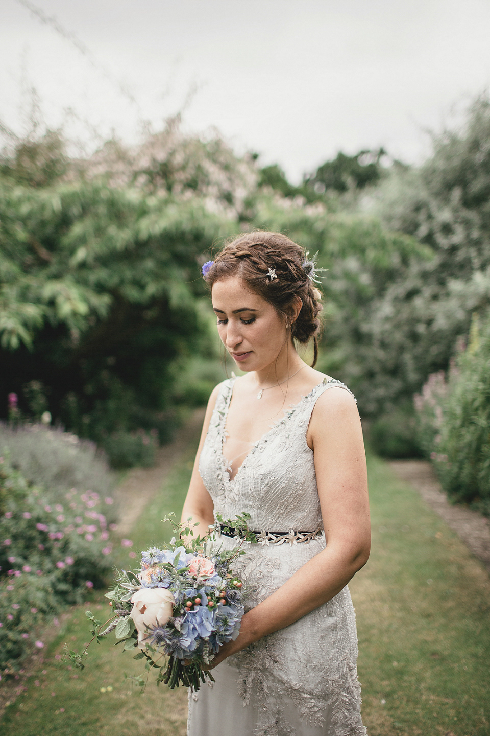 A modern Jewish wedding - the bride wears a gown by Wilden Bride. Photography by Kat Hill.