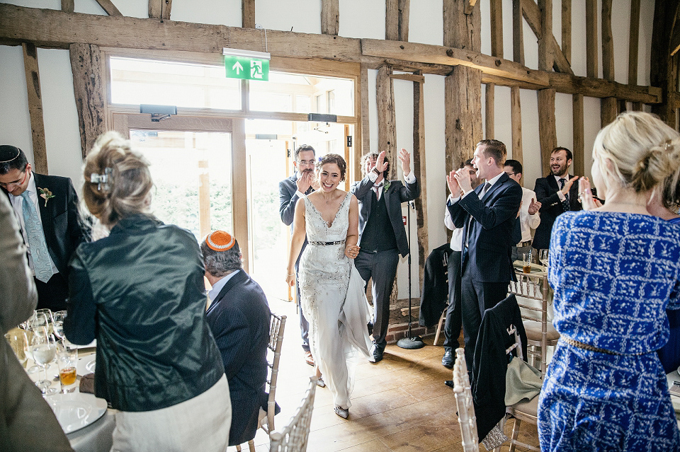 A modern Jewish wedding - the bride wears a gown by Wilden Bride. Photography by Kat Hill.