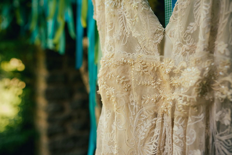 Anna wore a pale gold wedding dress designed by Jane Bourvis for her English country wedding. Photography by Lucy Greenhill.