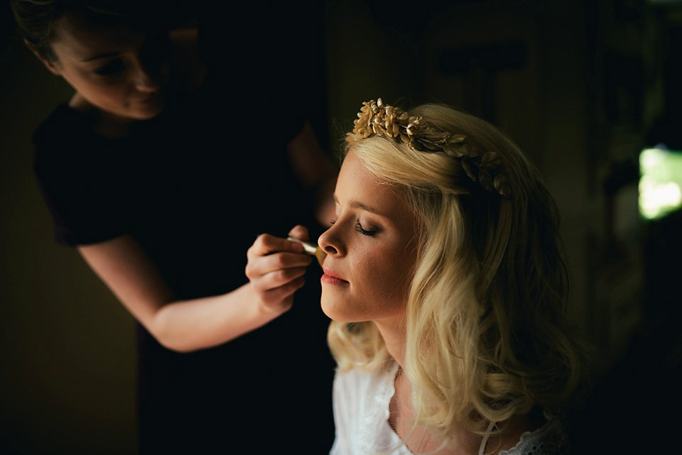 Anna wore a pale gold wedding dress designed by Jane Bourvis for her English country wedding. Photography by Lucy Greenhill.