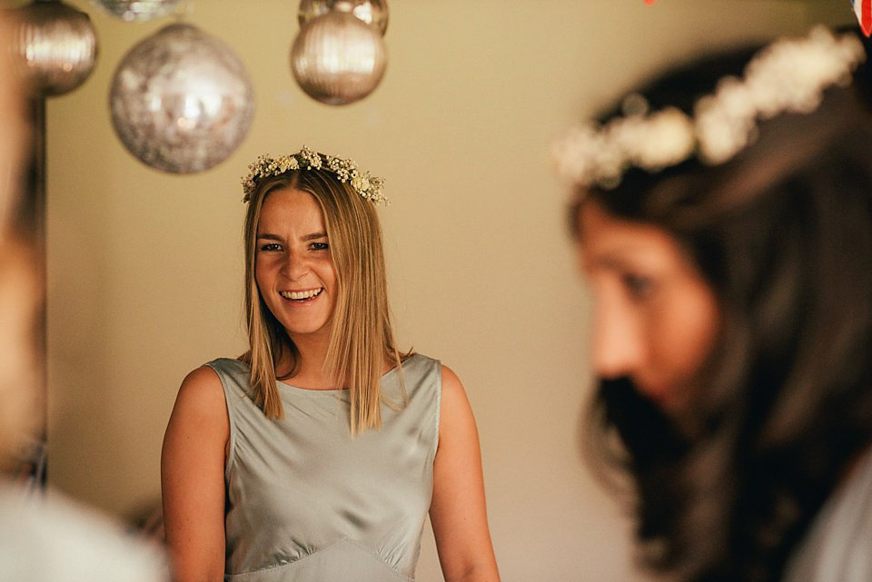 Anna wore a pale gold wedding dress designed by Jane Bourvis for her English country wedding. Photography by Lucy Greenhill.
