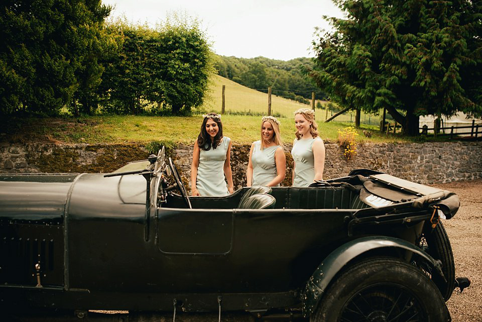 Anna wore a pale gold wedding dress designed by Jane Bourvis for her English country wedding. Photography by Lucy Greenhill.