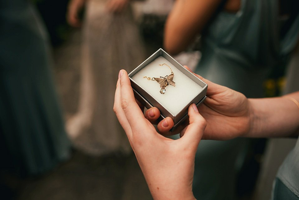 Anna wore a pale gold wedding dress designed by Jane Bourvis for her English country wedding. Photography by Lucy Greenhill.
