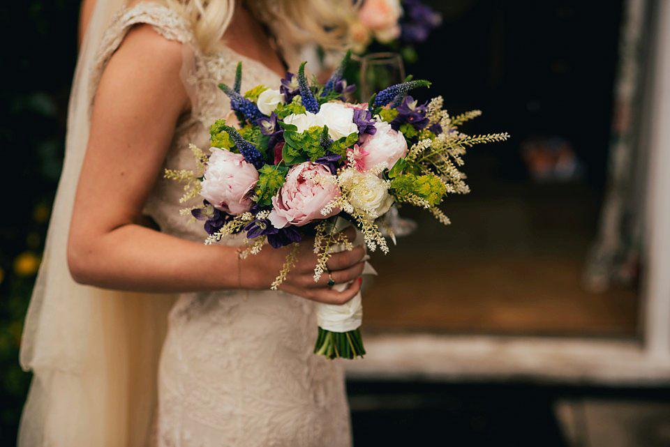 Anna wore a pale gold wedding dress designed by Jane Bourvis for her English country wedding. Photography by Lucy Greenhill.