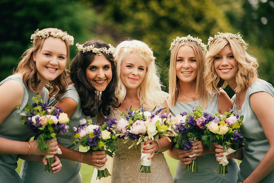 Anna wore a pale gold wedding dress designed by Jane Bourvis for her English country wedding. Photography by Lucy Greenhill.