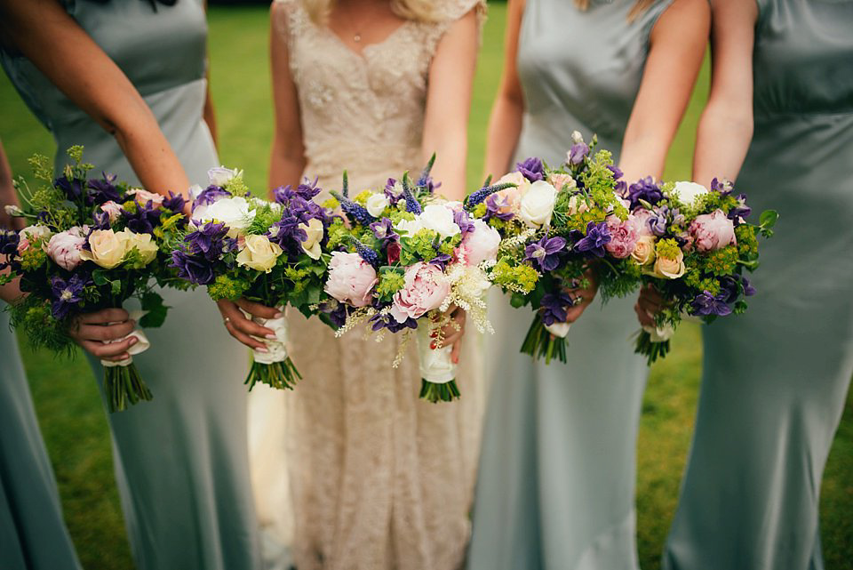 Anna wore a pale gold wedding dress designed by Jane Bourvis for her English country wedding. Photography by Lucy Greenhill.