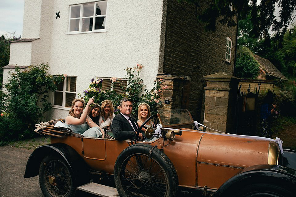 Anna wore a pale gold wedding dress designed by Jane Bourvis for her English country wedding. Photography by Lucy Greenhill.
