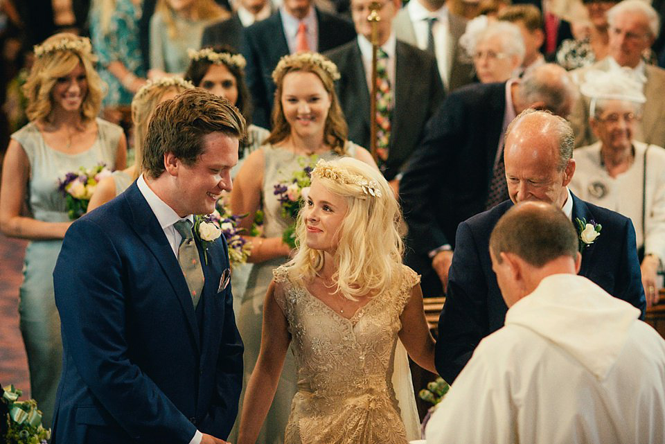 Anna wore a pale gold wedding dress designed by Jane Bourvis for her English country wedding. Photography by Lucy Greenhill.