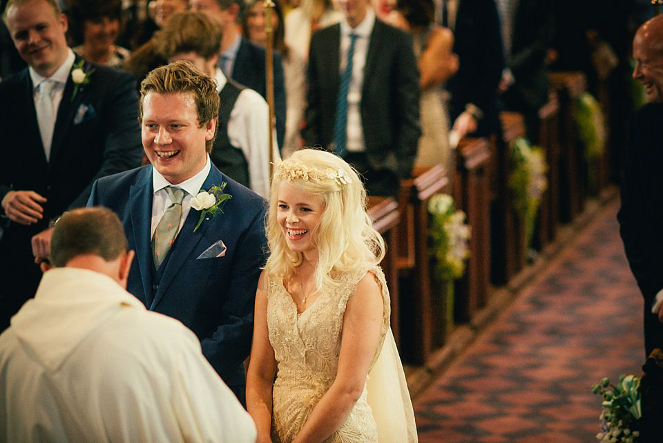 Anna wore a pale gold wedding dress designed by Jane Bourvis for her English country wedding. Photography by Lucy Greenhill.