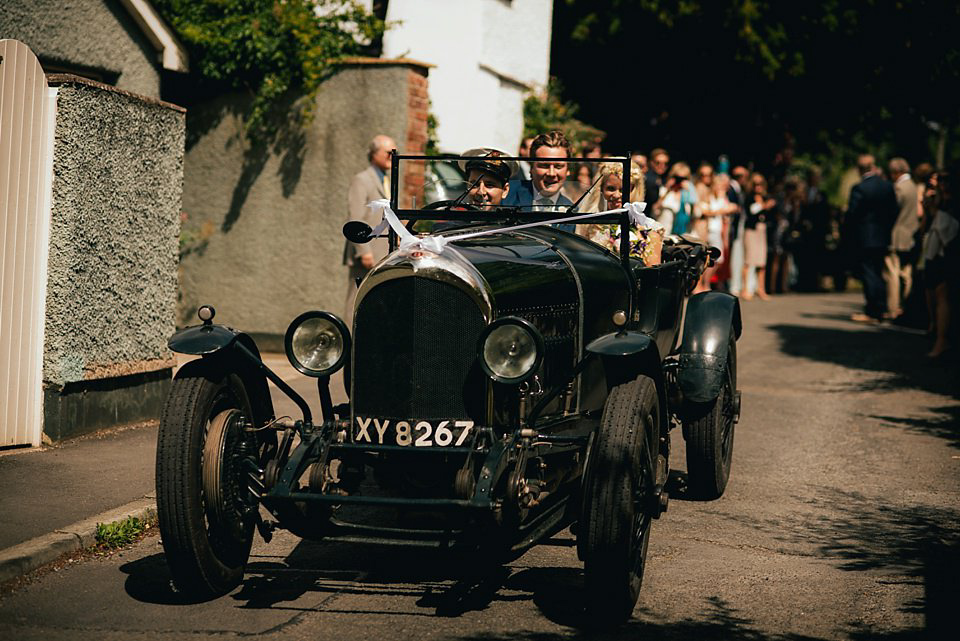 Anna wore a pale gold wedding dress designed by Jane Bourvis for her English country wedding. Photography by Lucy Greenhill.